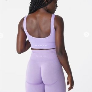 Three (3) NVGTN sports bras (size S)